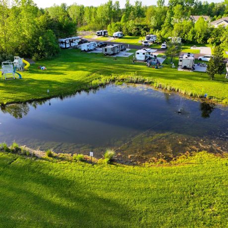 Aerial view of Hidden Ponds cottages surrounded by nature in South Haven